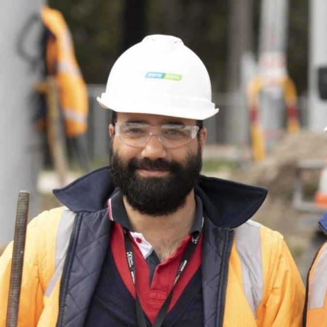 Male project manager wearing a hard hat and high visibility jacket