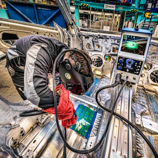 Rail worker welding inside a train